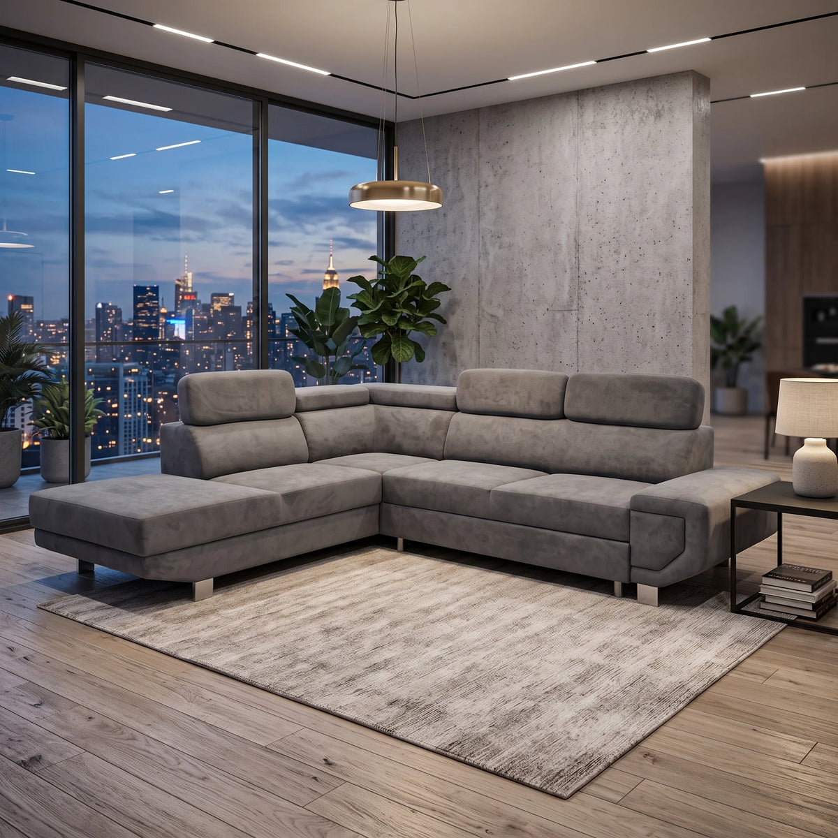 A modern L-shaped gray fabric sectional sofa in a contemporary living room with a concrete wall, large windows overlooking a city skyline at dusk, a light rug, and a black side table.